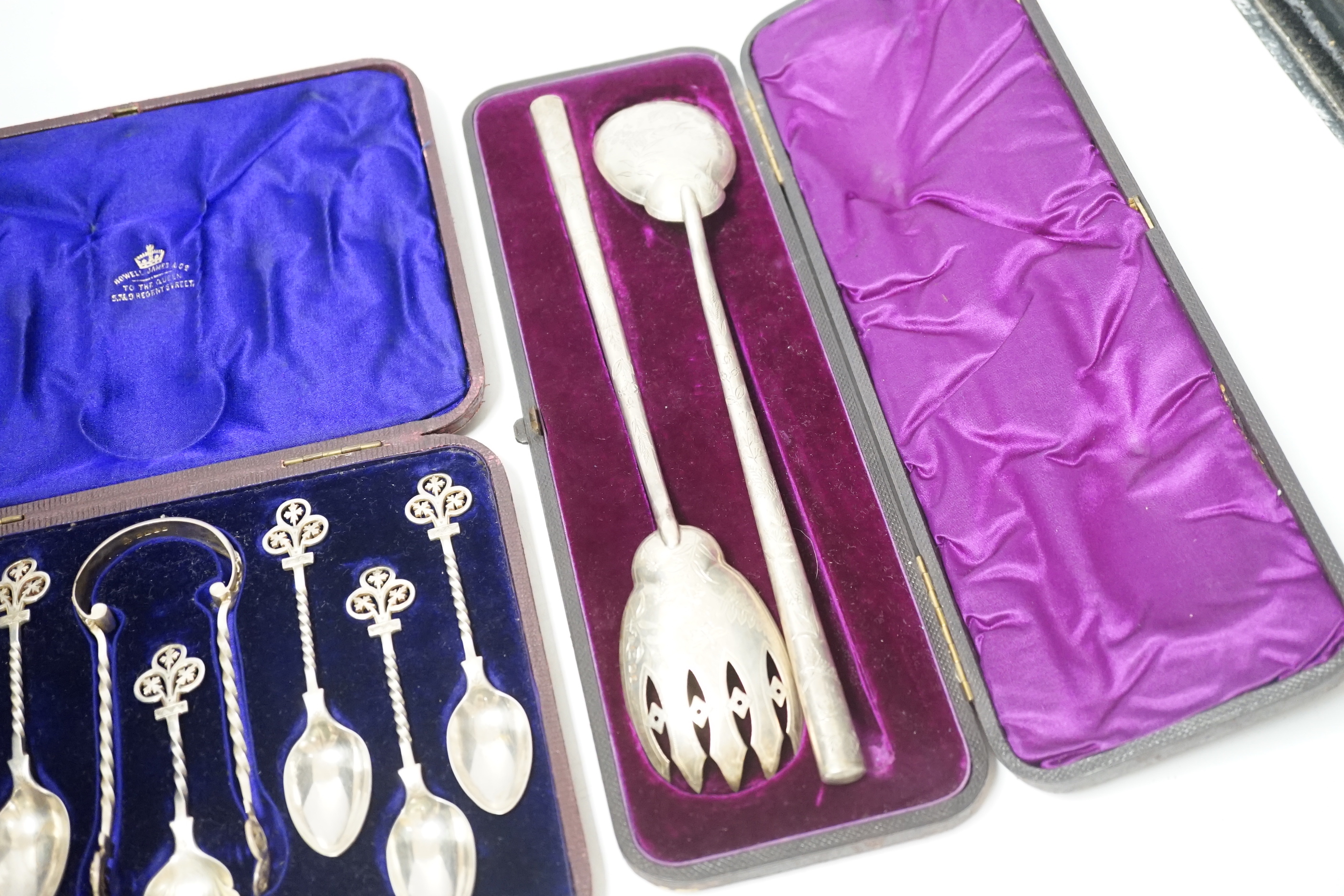 A cased pair of Victorian aesthetic period silver salad servers, Atkin Brothers, Sheffield, 1881 and a cased set of silver teaspoons, sugar spoon and tongs.